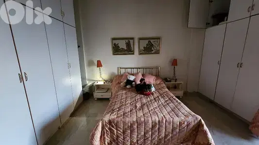 Queen Bed with 2 side tables and closet