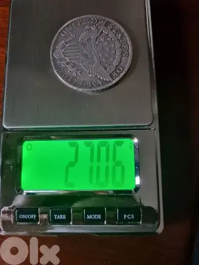 A silver old coin 15 dollars the gram