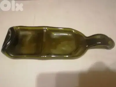 Decorative squeezed glass bottle ashtray