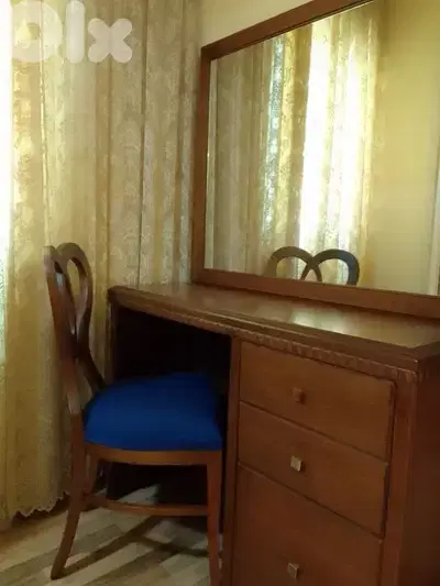 commode with mirror and chair
