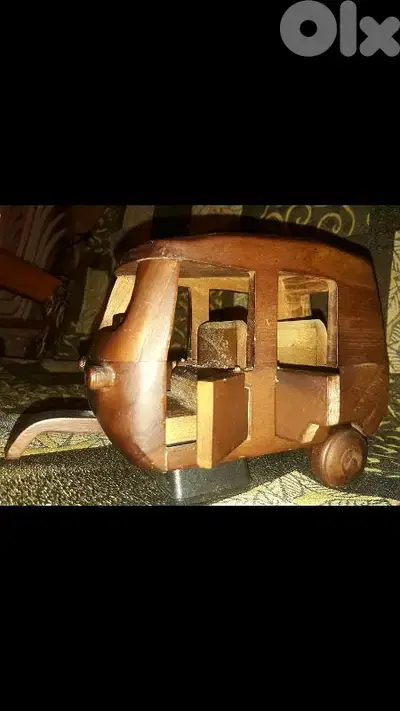 A beautiful vintage masterpiece of tricycle car handmade of wood