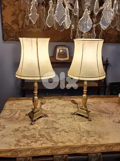 pair of bronze and leather top lamps