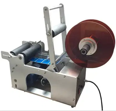 Labeling machine   آلة وضع الملصقات