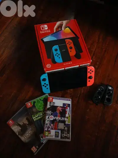 Nintendo switch oled with 3 video games plus all accessories