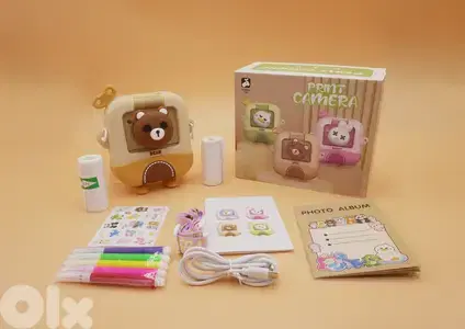 brown printing instant camera
