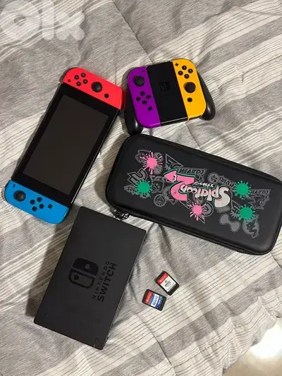 Nintendo Switch with 4 controllers, case, docking station and 2 games
