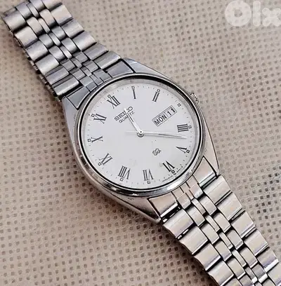 Vintage Seiko SQ Quartz white Roman Dial Day-Date Watch