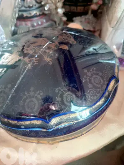 This is a vintage cobalt blue porcelain trinket box with gold floral a
