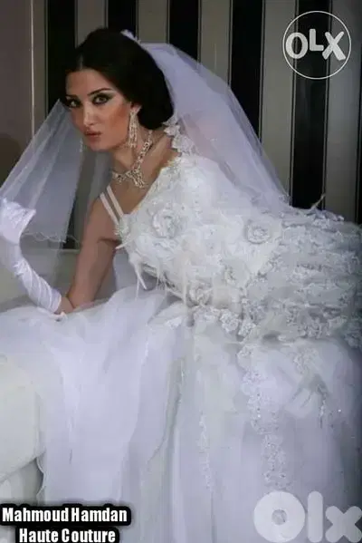 فستان عرس تطريز يدوي راقي مع ريش